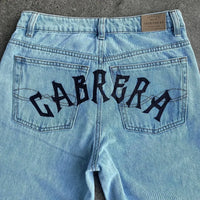 Trendy Y2K Anime Baggy Jeans featuring a Harajuku graphic print pattern, designed as high-waisted vintage streetwear for men and women.
