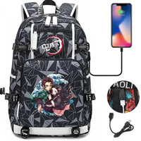 A pink and black Nezuko Demon Slayer Backpack featuring a USB charging port and kawaii anime character art, designed for teen girls and students.