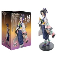 A high-quality Demon Slayer Action Figure PVC model collection featuring Kamado Tanjirou, Agatsuma Zenitsu, and Nezuko in dynamic warrior poses.