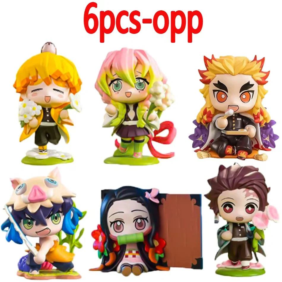A colorful Demon Slayer Blind Box containing a random cute PVC anime figure of Tanjiro or Nezuko, used as a desktop ornament.