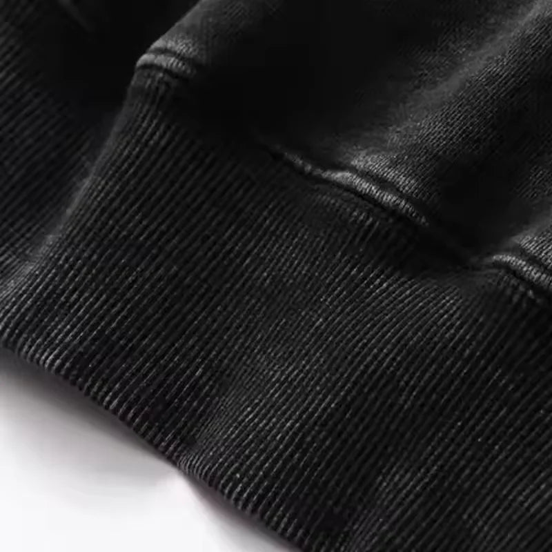 Close-up of the fabric texture on the Kenpachi Zaraki Bleach Vintage Washed Hoodie, showing the cotton fleece quality.