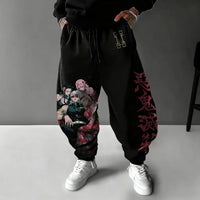 A pair of pure cotton Tokito Muichiro Jogger Pants featuring Japanese anime Demon Slayer graphic prints, designed as casual men's sport trousers.