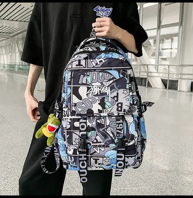 A high-capacity One Piece Luffy Backpack featuring a vibrant graffiti print of Monkey D. Luffy, designed as a durable school bag for middle and high students.