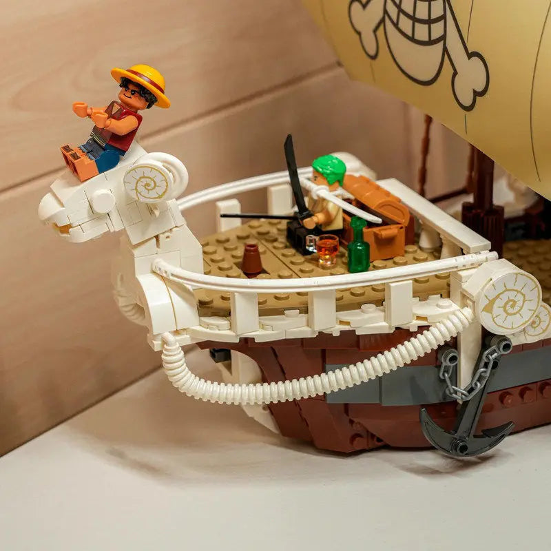 A detailed One Piece Going Merry Building Blocks set featuring the Straw Hat Pirate Ship, designed as an assembly model toy for children and collectors.