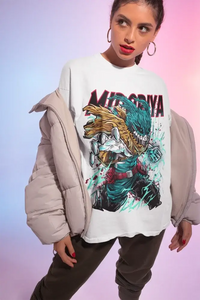 An oversized Deku T-Shirt featuring colorful anime graphic art of Midoriya, Bakugo, and Shoto styled for women's streetwear.