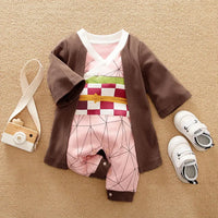 A newborn infant wearing the Baby Anime Costume, a cosplay jumpsuit available in Luffy, Akatsuki, and Vegeta styles.