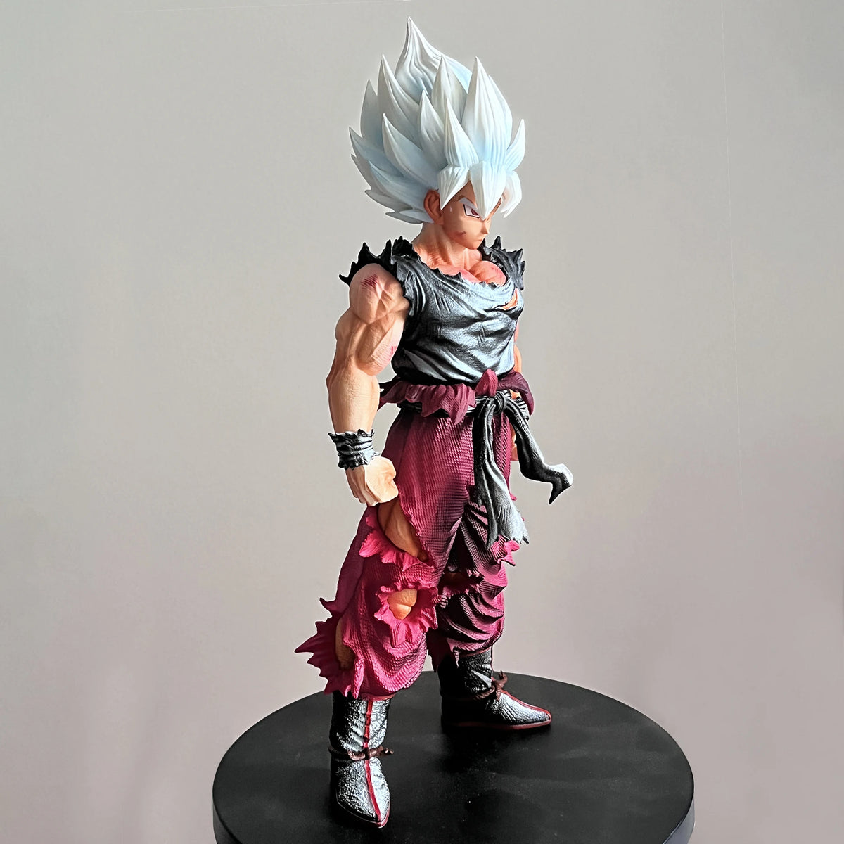 Close-up of Son Goku Super Saiyan Action Figure golden hair aura detail Dragon Ball PVC model