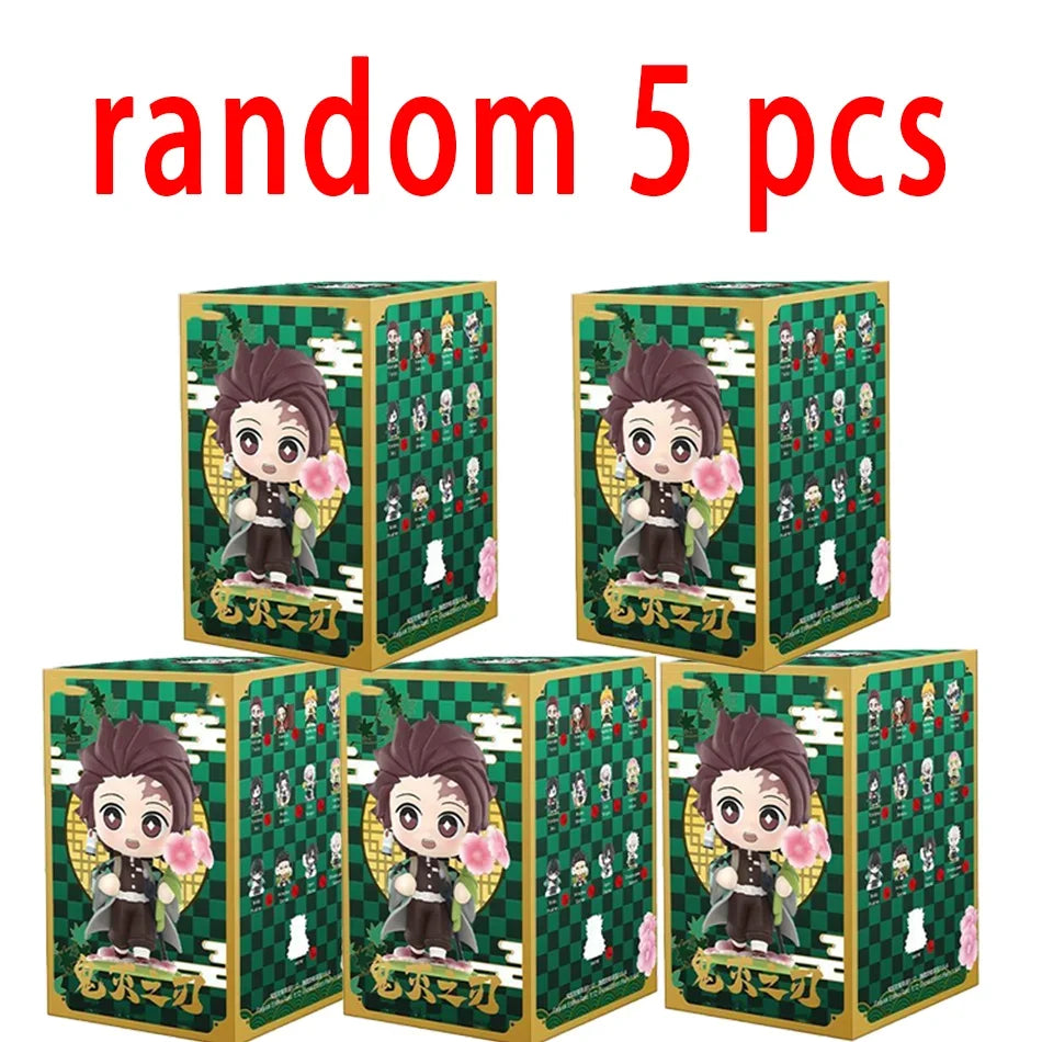 A colorful Demon Slayer Blind Box containing a random cute PVC anime figure of Tanjiro or Nezuko, used as a desktop ornament.
