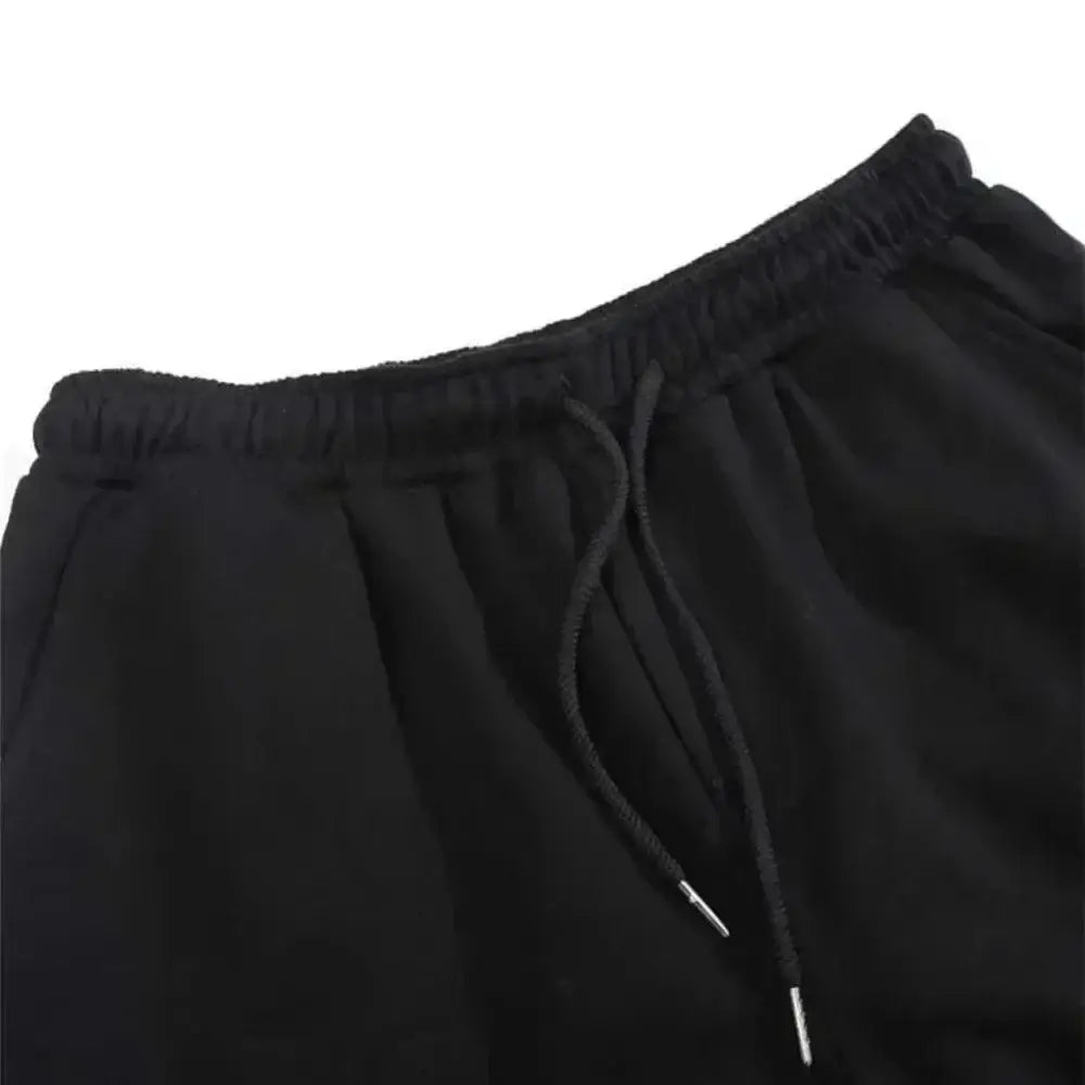 A pair of pure cotton Tokito Muichiro Jogger Pants featuring Japanese anime Demon Slayer graphic prints, designed as casual men's sport trousers.