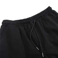 A pair of pure cotton Tokito Muichiro Jogger Pants featuring Japanese anime Demon Slayer graphic prints, designed as casual men's sport trousers.