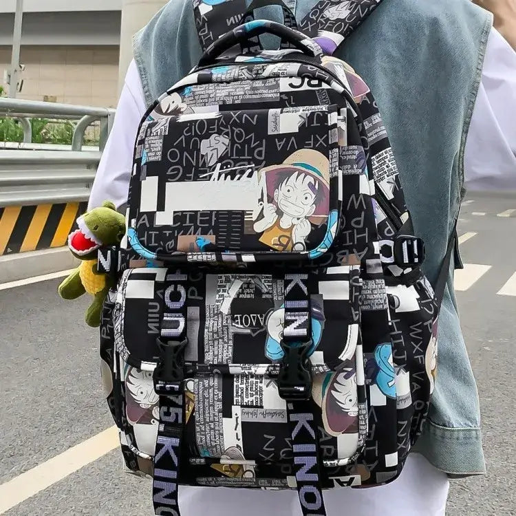 A high-capacity One Piece Luffy Backpack featuring a vibrant graffiti print of Monkey D. Luffy, designed as a durable school bag for middle and high students.