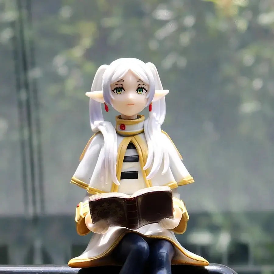 A high-quality 14cm Frieren Anime Figure sitting down, functioning as a noodle stopper and desktop decoration.