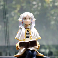 A high-quality 14cm Frieren Anime Figure sitting down, functioning as a noodle stopper and desktop decoration.