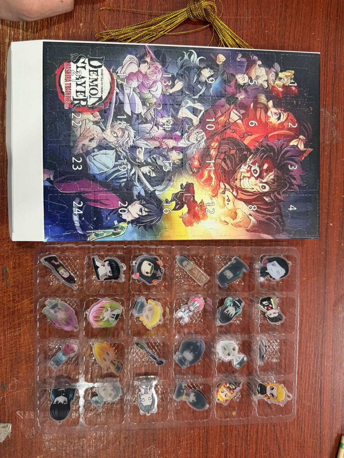 Demon Slayer Anime Advent Calendar open showing 2D flat PVC figures Christmas anime countdown