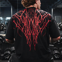 Dark Oversized Cotton Tee Skull Print shown on a model, highlighting the alternative fashion style suitable for men and women's streetwear and gym workouts.