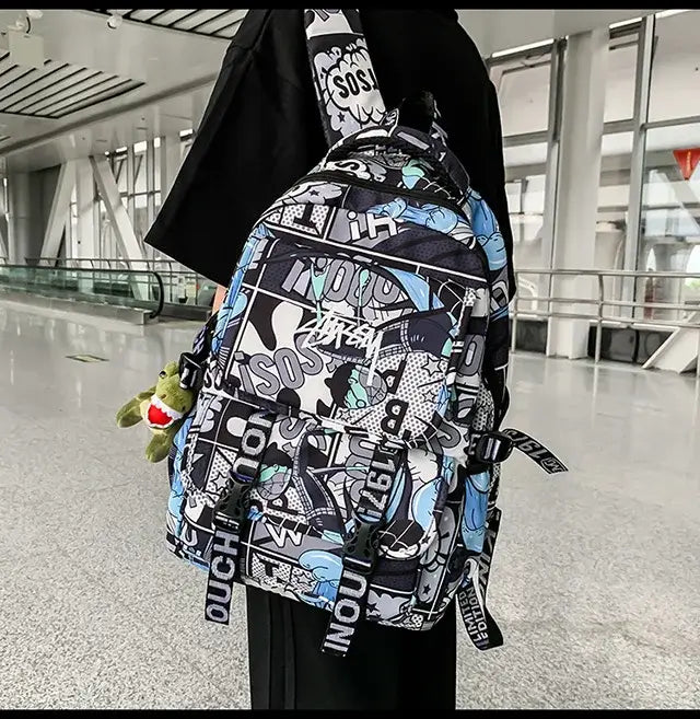 A high-capacity One Piece Luffy Backpack featuring a vibrant graffiti print of Monkey D. Luffy, designed as a durable school bag for middle and high students.