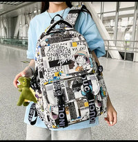A high-capacity One Piece Luffy Backpack featuring a vibrant graffiti print of Monkey D. Luffy, designed as a durable school bag for middle and high students.