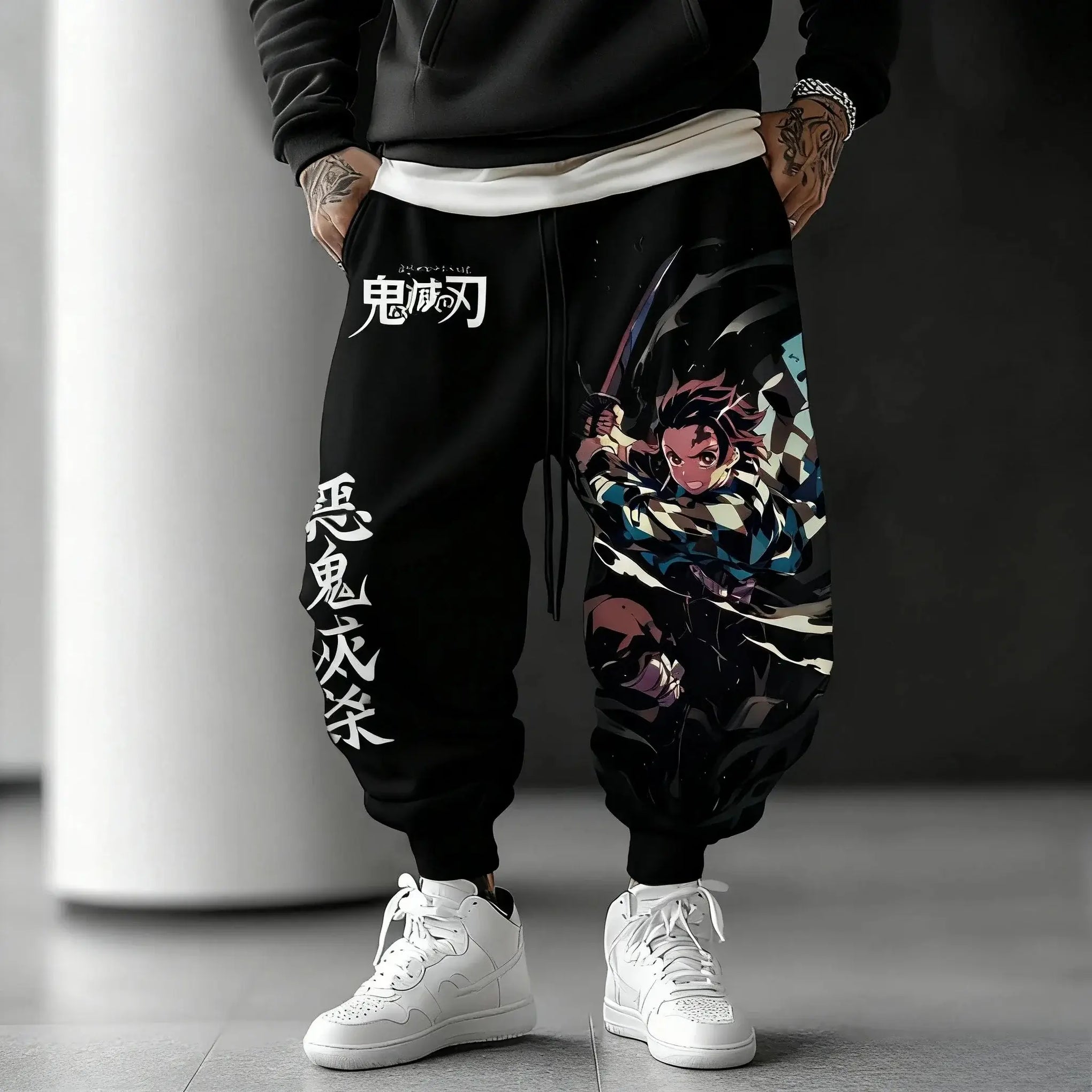 A man wearing the loose-fit Demon Slayer Anime Men Sweatpants with a Japanese cartoon print, showcasing a casual hip hop and Y2K streetwear style.