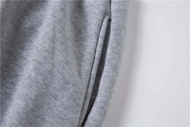 Close-up of Luffy Gear 5 Pants showing the side pocket detail in soft gray fabric, perfect for winter streetwear.