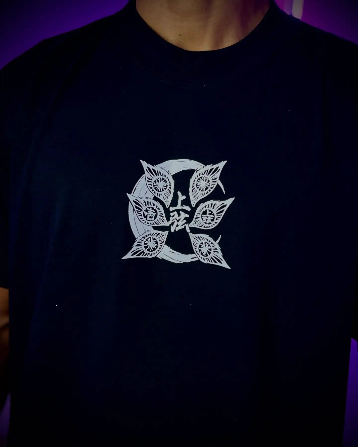 A couple wearing matching oversized Demon Slayer Graphic T Shirts in a hip hop, Y2K streetwear style.