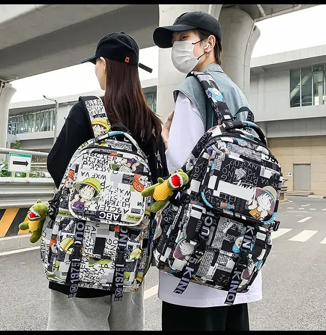 A high-capacity One Piece Luffy Backpack featuring a vibrant graffiti print of Monkey D. Luffy, designed as a durable school bag for middle and high students.