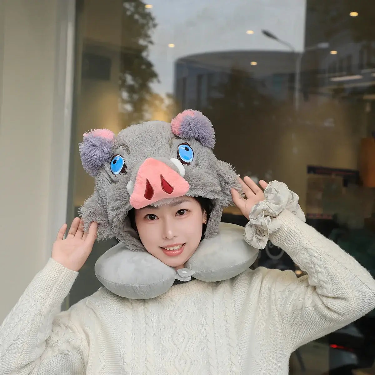 Inosuke Boar Head Plush Cosplay Neck Pillow worn by a person, featuring a cute animal design and U-shaped neck support.