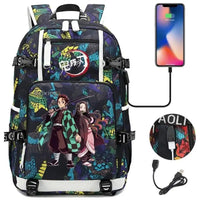 A pink and black Nezuko Demon Slayer Backpack featuring a USB charging port and kawaii anime character art, designed for teen girls and students.