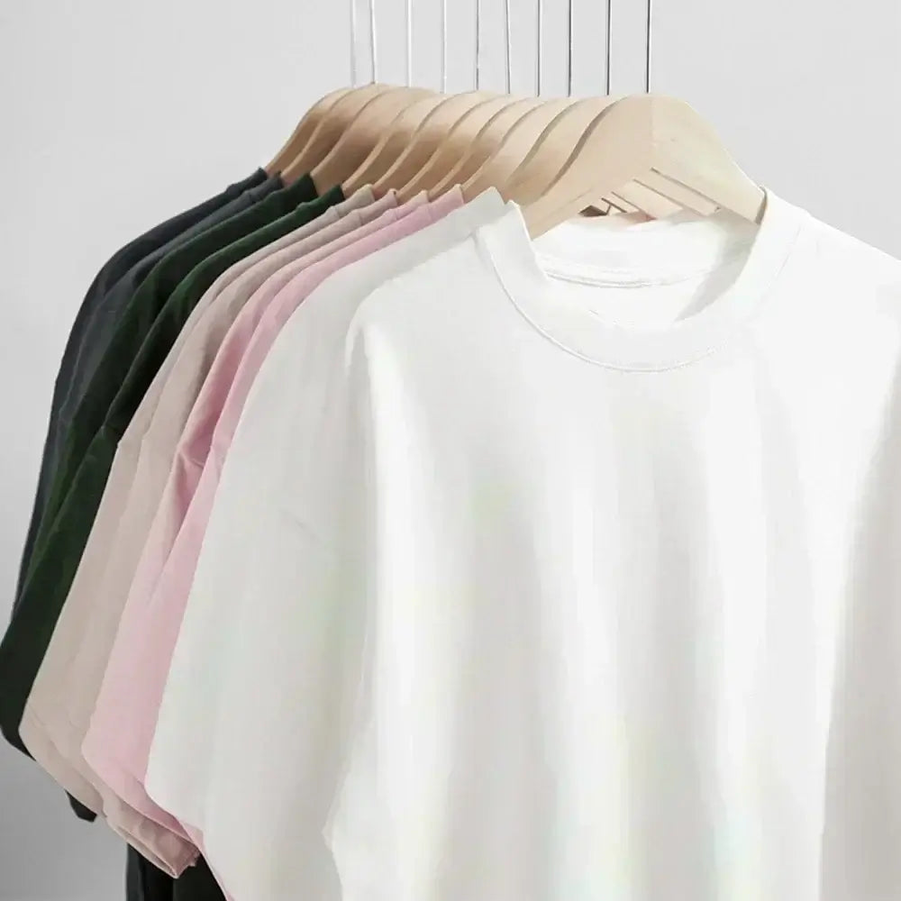 Fullmetal Alchemist Manga T-Shirt in various colors displayed on hangers showcasing oversized fit and cotton material.