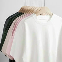 Fullmetal Alchemist Manga T-Shirt in various colors displayed on hangers showcasing oversized fit and cotton material.