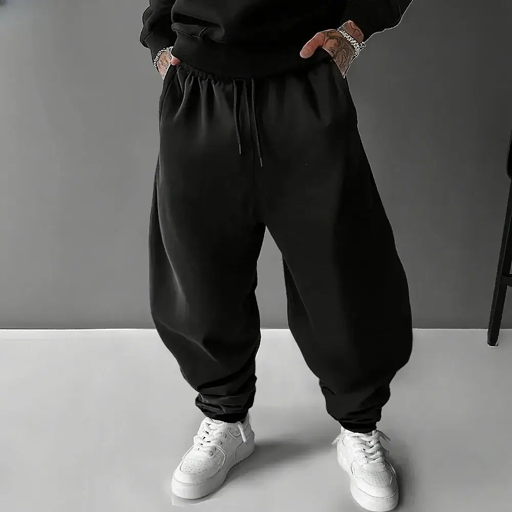 A pair of pure cotton Tokito Muichiro Jogger Pants featuring Japanese anime Demon Slayer graphic prints, designed as casual men's sport trousers.