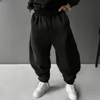 A pair of pure cotton Tokito Muichiro Jogger Pants featuring Japanese anime Demon Slayer graphic prints, designed as casual men's sport trousers.