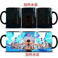 A ceramic One Piece Color Changing Mug revealing Gear 5 Nika Luffy and Fire Fist Ace artwork when filled with hot liquid.