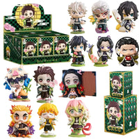 A colorful Demon Slayer Blind Box containing a random cute PVC anime figure of Tanjiro or Nezuko, used as a desktop ornament.