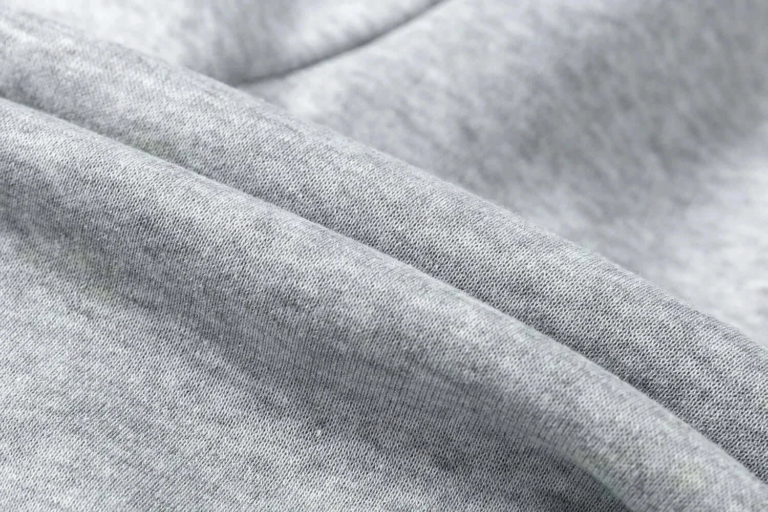 A man wearing the loose-fit Demon Slayer Anime Men Sweatpants with a Japanese cartoon print, showcasing a casual hip hop and Y2K streetwear style.