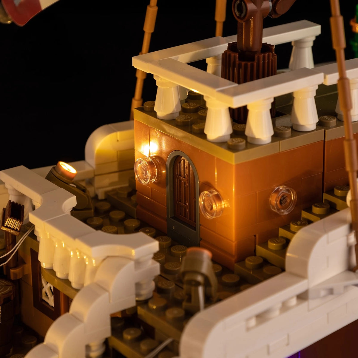 A Going Merry LED Light Set illuminating the 75639 pirate ship building block model, showcasing glowing cabins and deck lights.