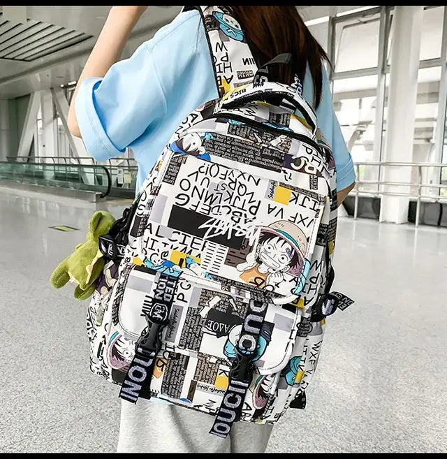 A high-capacity One Piece Luffy Backpack featuring a vibrant graffiti print of Monkey D. Luffy, designed as a durable school bag for middle and high students.