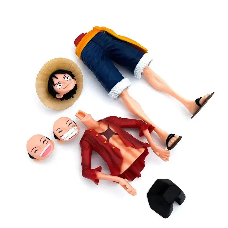 A 28cm One Piece Luffy Figure made of PVC, featuring three interchangeable face plates showing confident and smiley expressions for custom display.