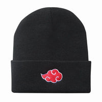 A black knitted Akatsuki Beanie featuring the red cloud embroidery symbol, designed as a warm unisex winter hat for men and women.