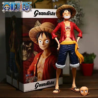 A 28cm One Piece Luffy Figure made of PVC, featuring three interchangeable face plates showing confident and smiley expressions for custom display.