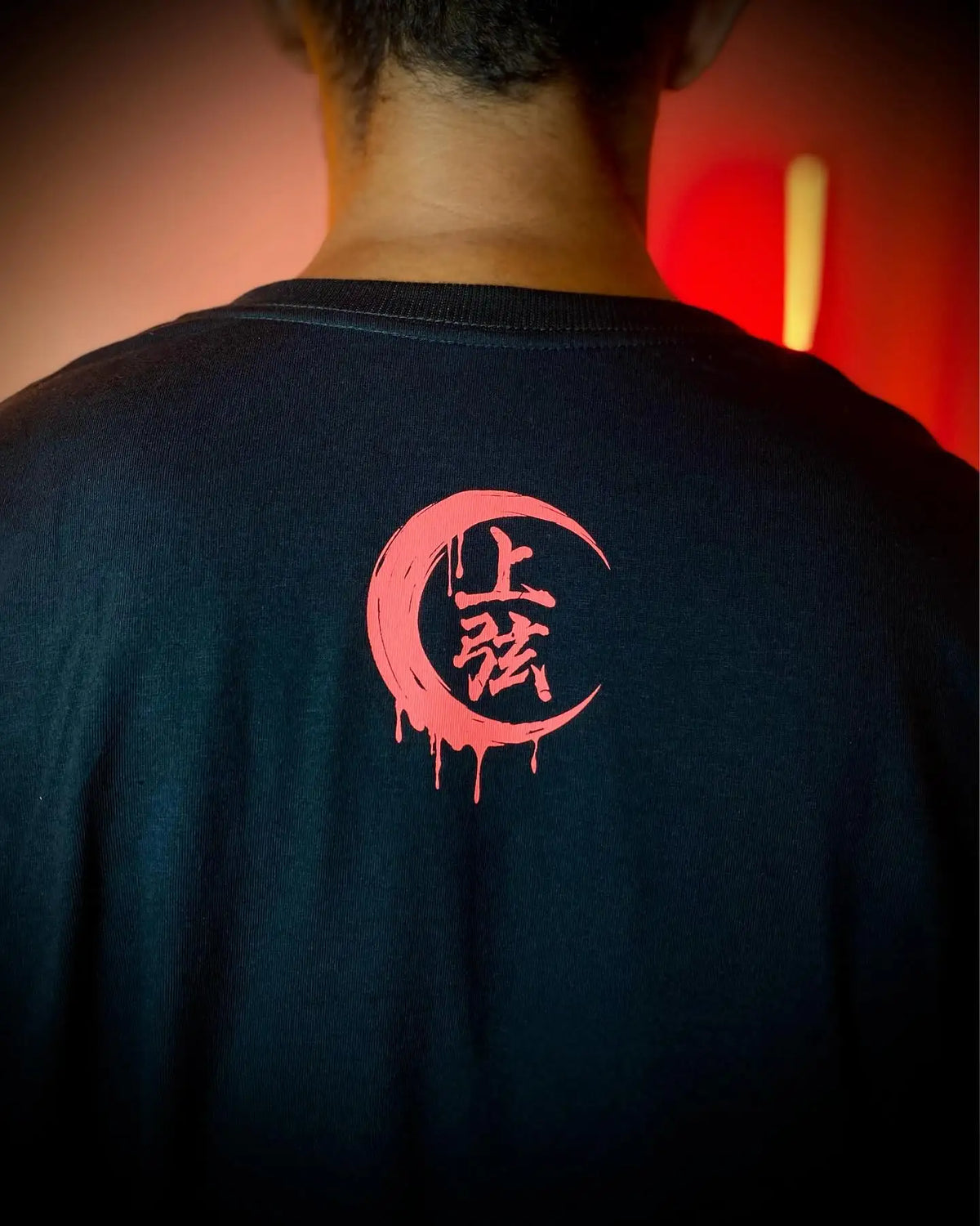 A couple wearing matching oversized Demon Slayer Graphic T Shirts in a hip hop, Y2K streetwear style.