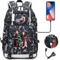 A pink and black Nezuko Demon Slayer Backpack featuring a USB charging port and kawaii anime character art, designed for teen girls and students.
