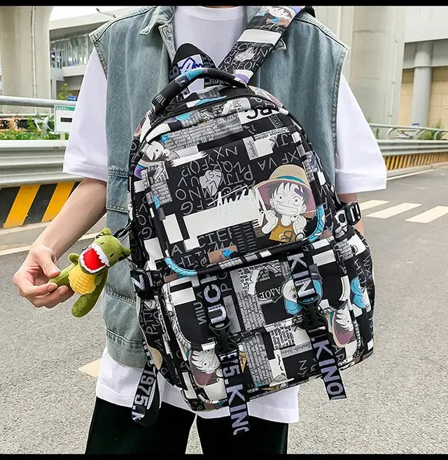 A high-capacity One Piece Luffy Backpack featuring a vibrant graffiti print of Monkey D. Luffy, designed as a durable school bag for middle and high students.