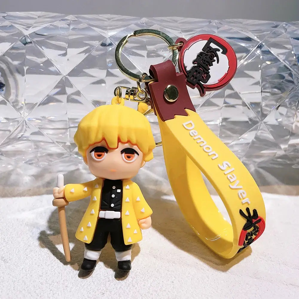 3D Demon Slayer Keychains featuring cute anime character dolls like Tanjiro and Nezuko, used as car ignition accessories and backpack pendants.