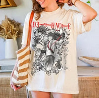 A trendy Death Note T-shirt featuring high-definition anime graphic art of Light Yagami and Ryuk, designed as a unisex Japanese manga top.