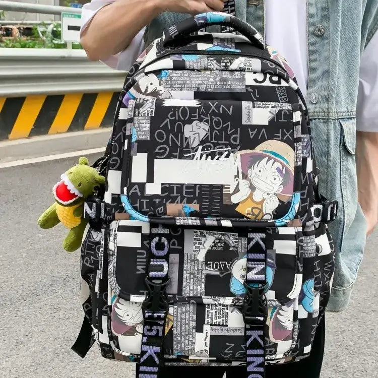 A high-capacity One Piece Luffy Backpack featuring a vibrant graffiti print of Monkey D. Luffy, designed as a durable school bag for middle and high students.