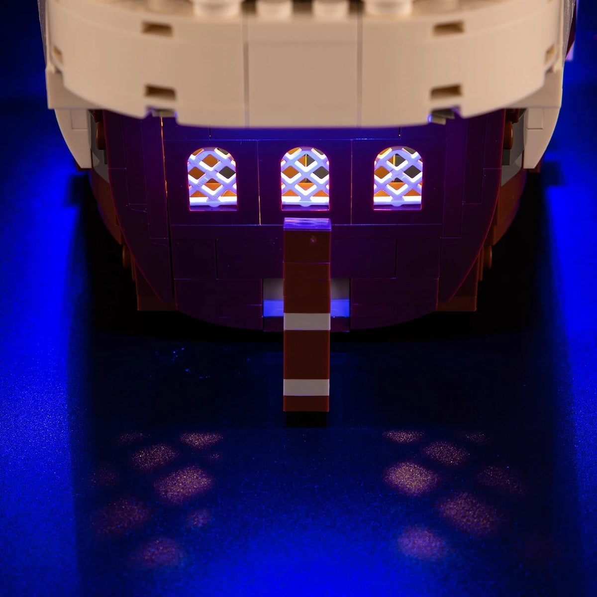 A Going Merry LED Light Set illuminating the 75639 pirate ship building block model, showcasing glowing cabins and deck lights.