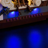A Going Merry LED Light Set illuminating the 75639 pirate ship building block model, showcasing glowing cabins and deck lights.