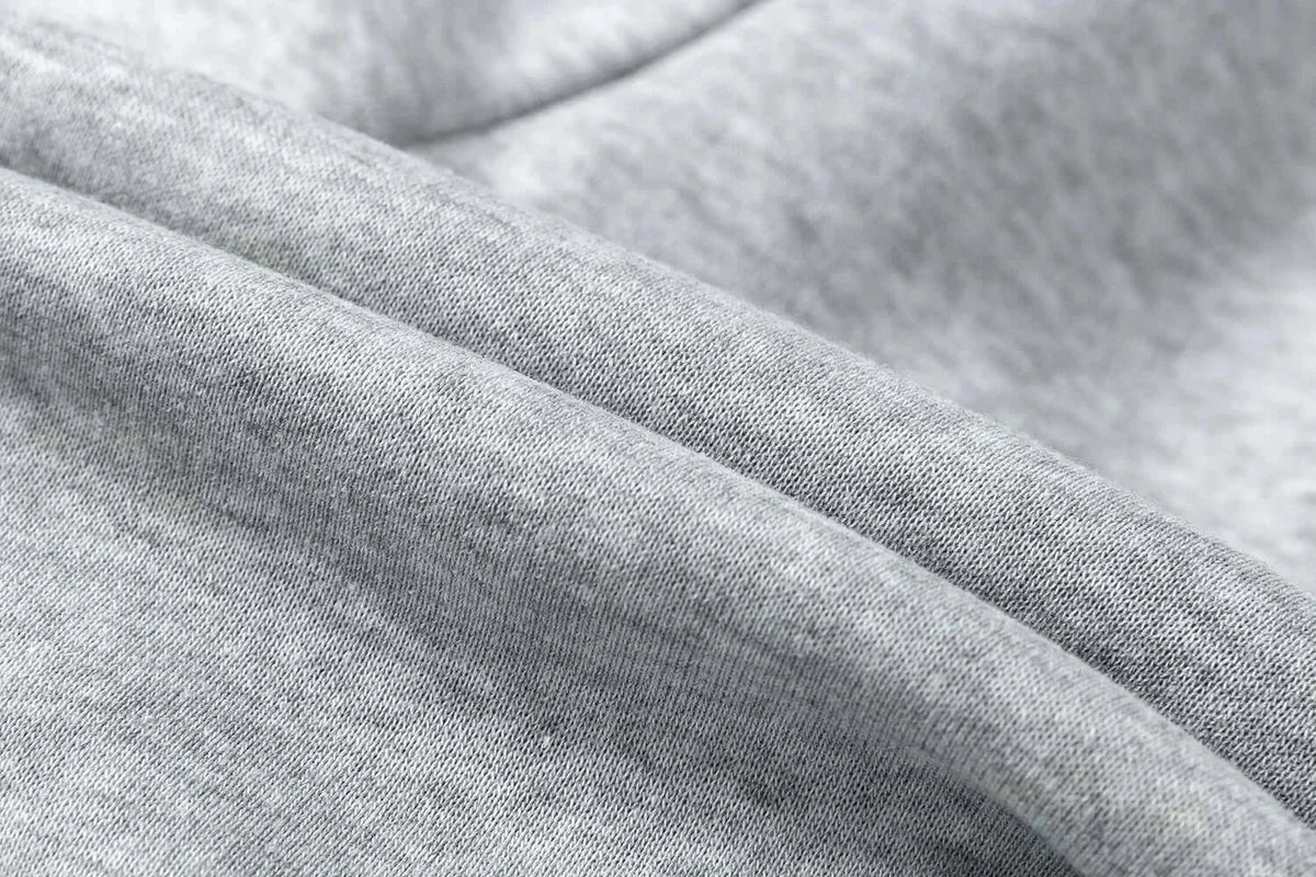 A pair of pure cotton Tokito Muichiro Jogger Pants featuring Japanese anime Demon Slayer graphic prints, designed as casual men's sport trousers.