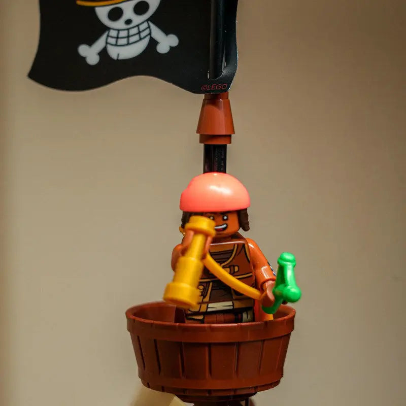 A detailed One Piece Going Merry Building Blocks set featuring the Straw Hat Pirate Ship, designed as an assembly model toy for children and collectors.