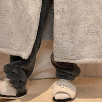 A plush One Piece Luffy Bathrobe and trouser set made of thick coral fleece, featuring cartoon anime embroidery for men's winter loungewear.